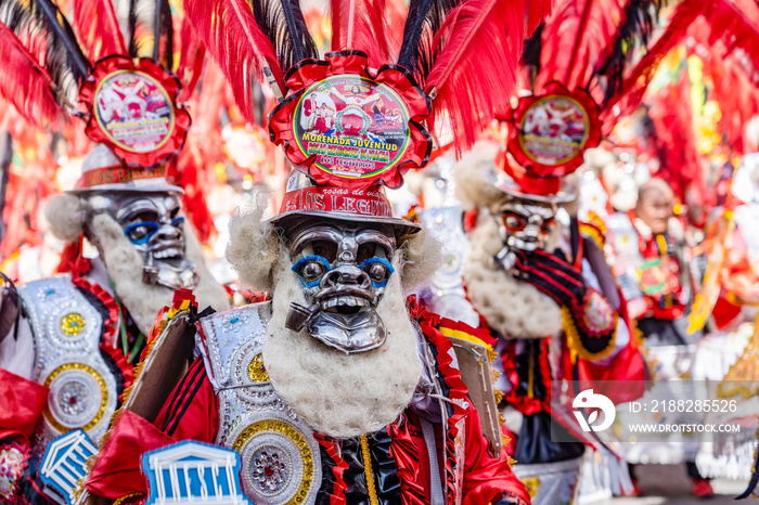 man in red mask at  The festival of the Santísima Trinidad del Señor Jesús del Gran Poder in the city of La Paz