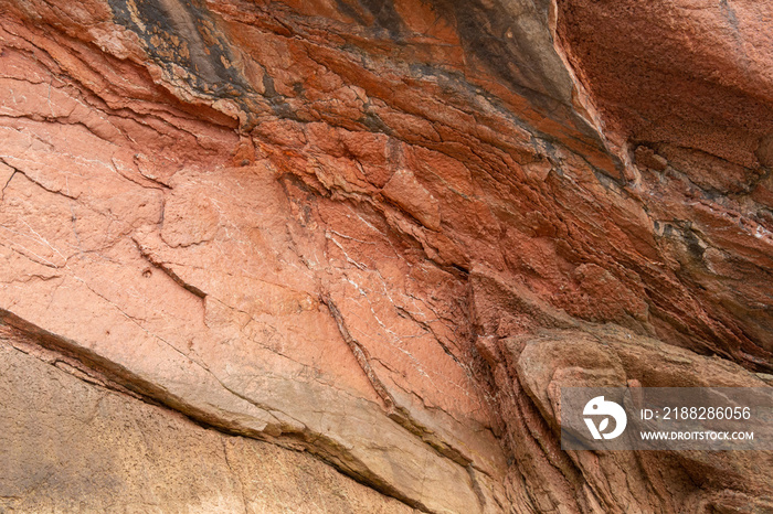 rocks with faults and winding sediments, on a beach in northern Spain, in asturias,