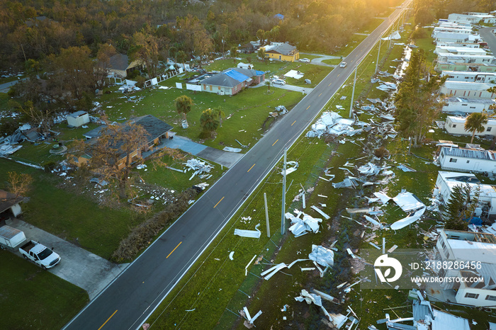 Severely damaged by hurricane Ian houses in Florida mobile home residential area. Consequences of natural disaster