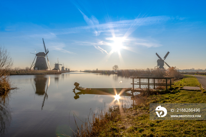 Twight light sunrise on the Unesco heritage windmill silhouette at the middle of the canal, Alblasserdam, Netherlands