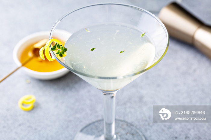 Honey and thyme lemon drop martini with garnish