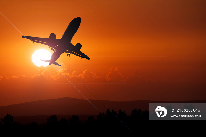 passenger plane silhouette Taking off from the airport. Passenger plane in the sky at sunrise or sunset. Vacation and travel concept. Toned image