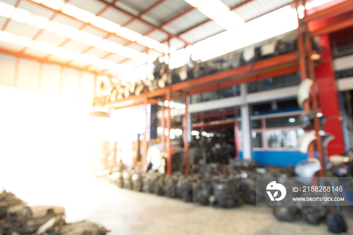 Background for banner design. Blur photo of Second-hand spare parts of old car parts warehouse store.