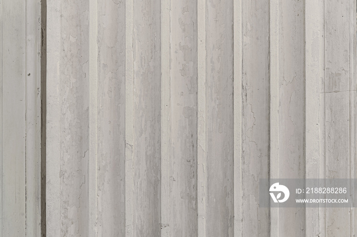 abstract background of an old  painted grey ribbed wall texture close up