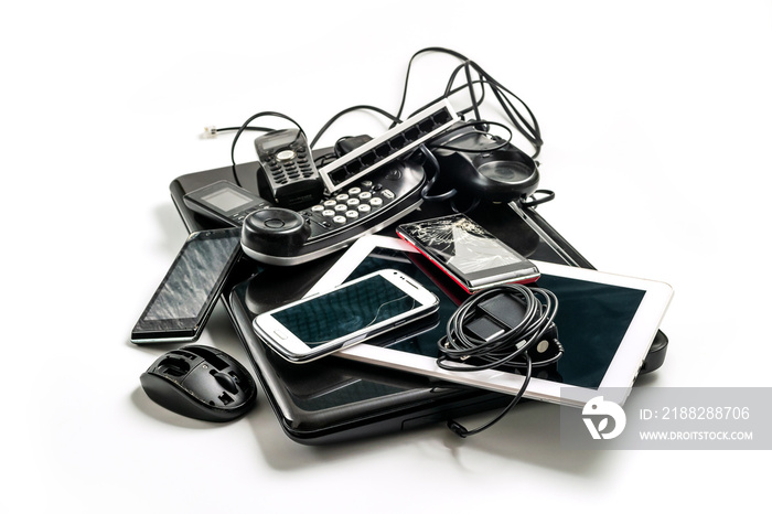 Electronic waste ready to recycle, isolated on white background.  pile of mixed electronic waste, old broken computer parts, laptops, cell phones