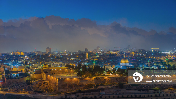 Illuminated skyline of the old city of Jerusalem at dusk - Israel