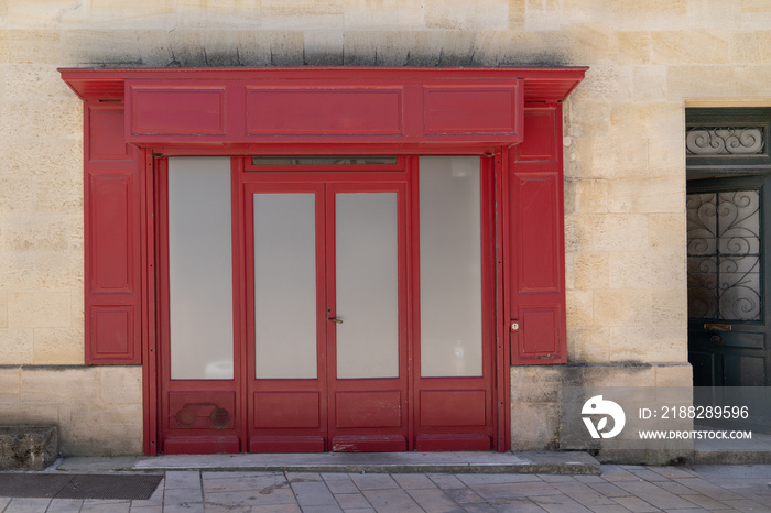 old retro empty shop facade bordeaux red in France Europe with blank copy frame space
