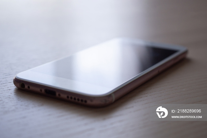 Mobile smartphone on wood table background