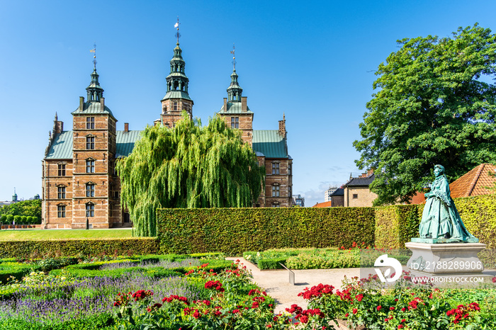 Statue of Queen Caroline Amalie and Rosenborg Castle, Dutch Renaissance palace, with a museum housing the crown jewels in Copenhagen, Denmark