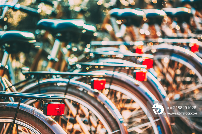 Row of city parked bicycles bikes for rent on sidewalk in European City Stockholm, Sweden