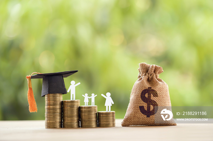 Black graduation cap, hat, student and kid, rows of rising coins, white clock on a table, natural green background. Public school funding, education funding, financial concept