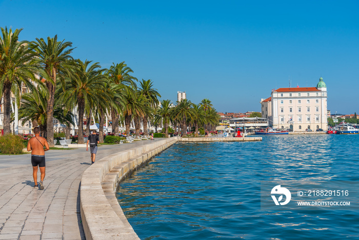 People are walking on seaside promenade in Split, Croatia