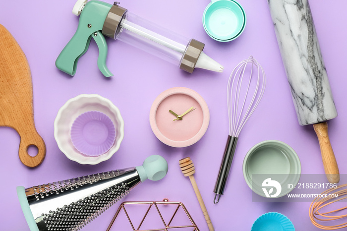 Set of kitchen utensils on color background