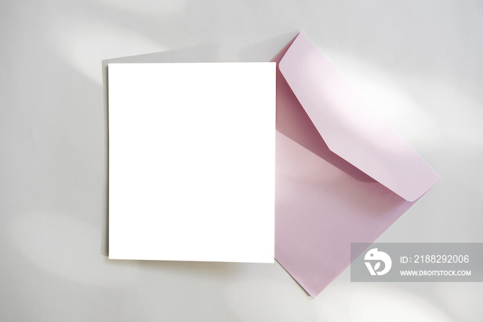 Blank white greeting card with envelope and flower. for mockup template.