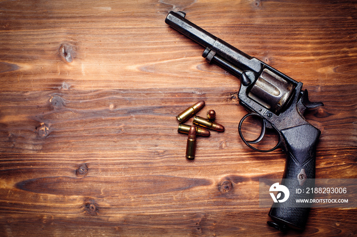 Vintage pistols on wooden background