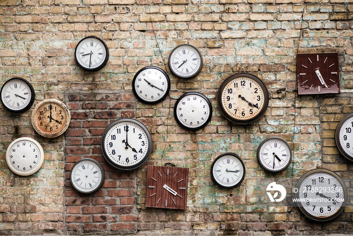 Old Clocks located on brick wall