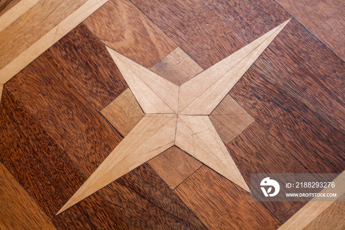 Vintage parquet with geometric star pattern