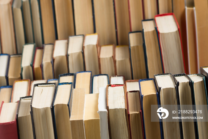 Stack of books background. many books piles.