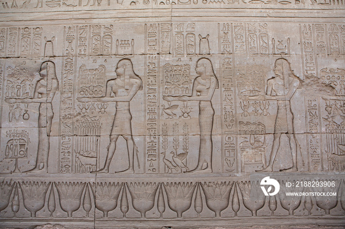 Dendera Temple complex in Egypt. Hieroglypic carvings on wall at the ancient egyptian temple.