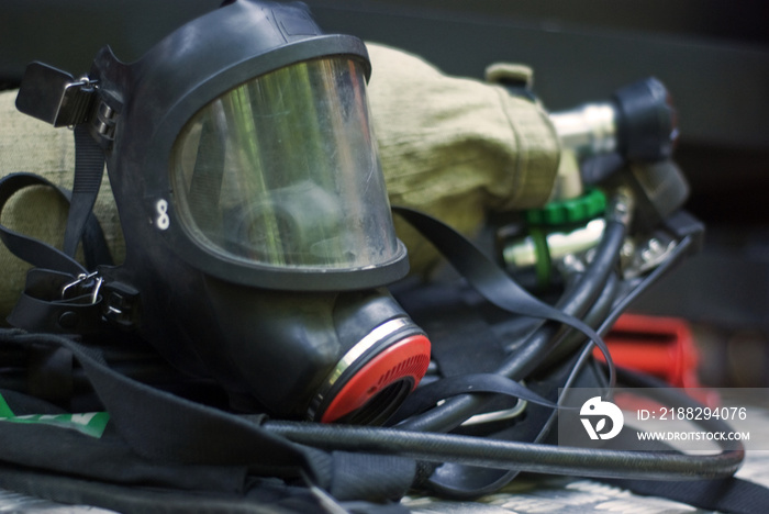 Fire extinguisher and gas mask of a firefighter, fire extinguishing equipment