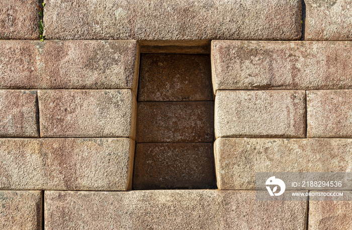 Trapezoid cavity in an Inca wall with perfect stonework, Machu Picchu, Cusco, Peru.