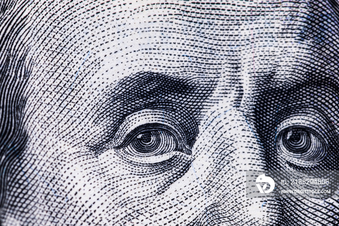 Macro close up of Ben Franklin’s face on the US $100 dollar bill.