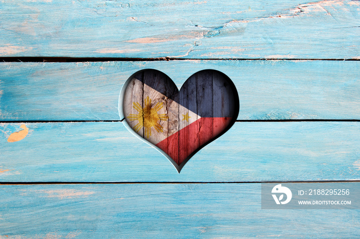 Love Philippines. Heart and flag on a blue wooden board