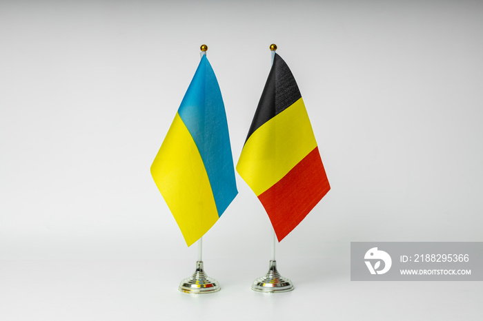 State flags of Ukraine and Belgium on a light background. State flags.