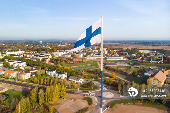 Aerial view of the largest finnish flag in the world and the tallest flagpole in Europe against of Hamina city, Finland. The flag pole is 100 meter high.