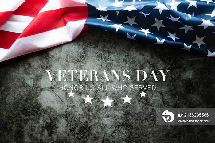 Veterans day. Honoring all who served. American flag on cement background