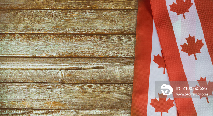 Canadian red and white flag against dark rustic background for Canada Day celebration and national holidays