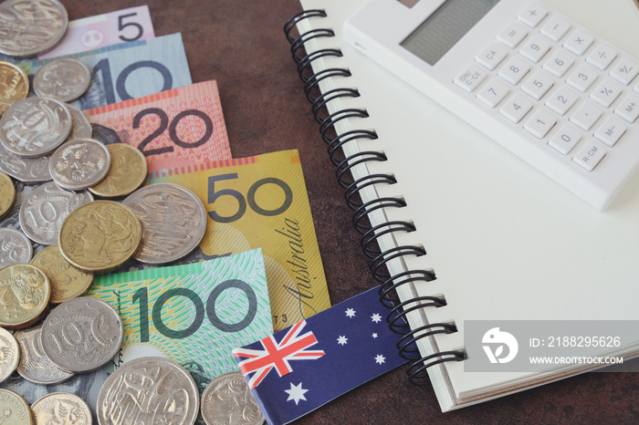 Australian money, AUD  calculator, and notebook, Coronavirus economic stimulus rescue package, superannuation concept