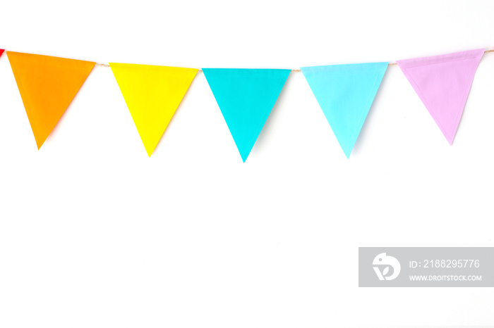 Colorful party flags hanging on white wall  background, birthday, anniversary, celebrate event, festival greeting card background