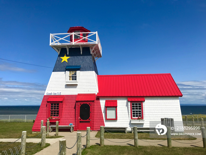 Grande Anse New Brunswick lighthouse painted in Acadian flag