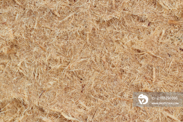 Fine sawdust, the waste is pressed into the sheet material. Photo in close-up (macro).