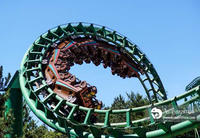 Rollercoaster track against a brilliant blue sky