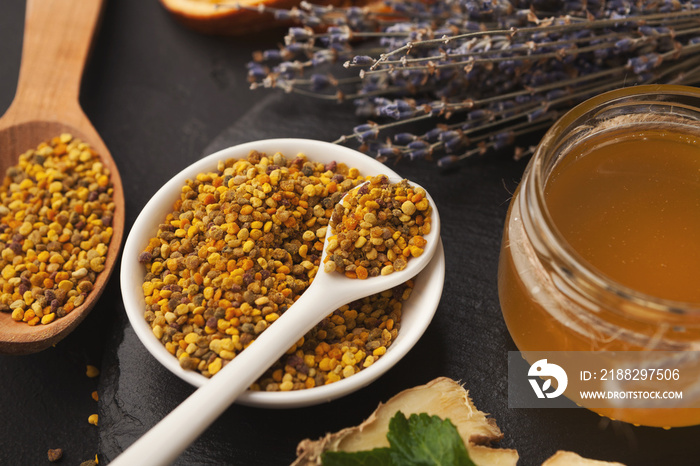 Jar of honey on wooden background