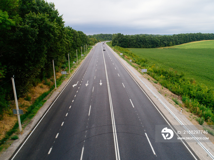 Aerial view asphalt road and green forest, Forest road going through forest with car adventure view from above, Ecosystem and ecology healthy environment concepts and background.