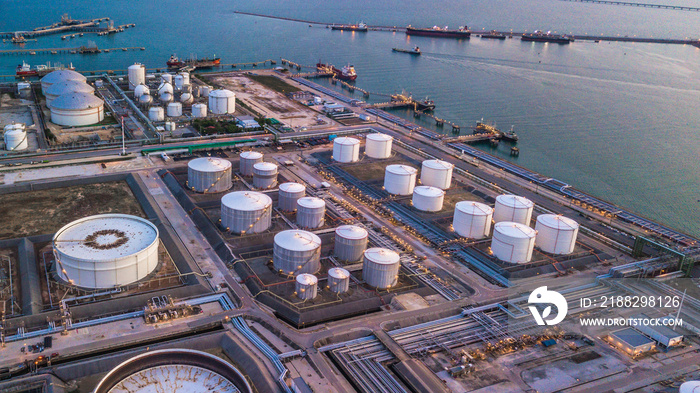 Aerial view oil terminal is industrial facility for storage of oil and petrochemical products ready for transport to further storage facilities.