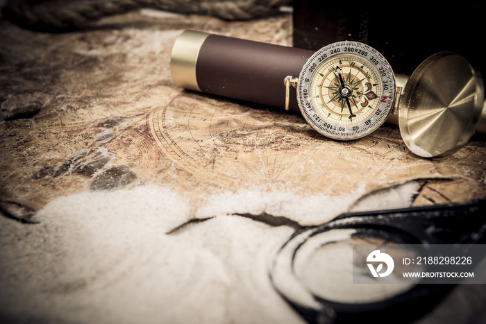 Columbus day. Pirates and treasure with worldmap and discovery equipment.