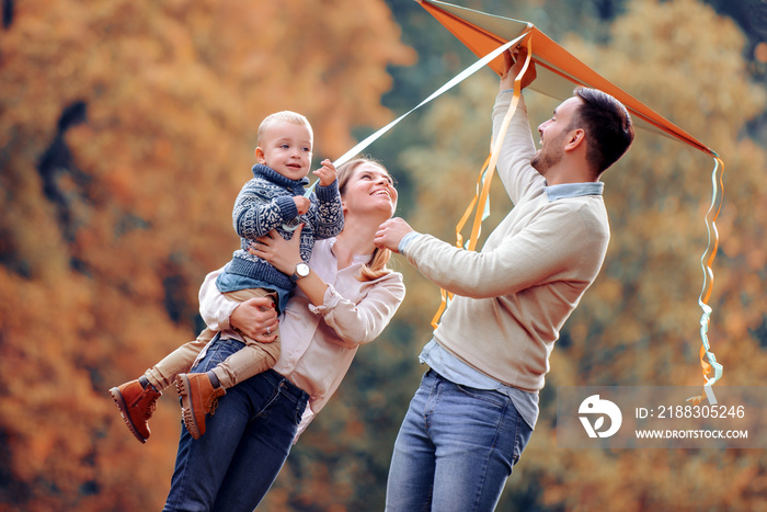 Happy family enjoying picnic in nature