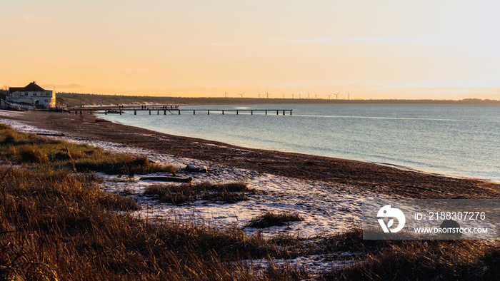 Angelholm beach in winter during golden hour in Sweden.