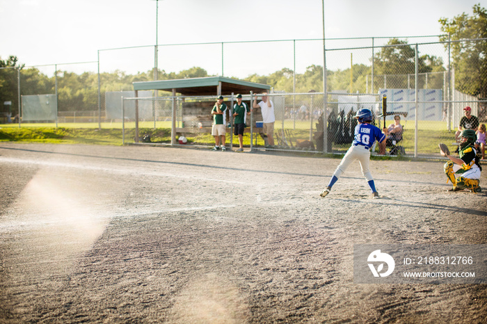 Young baseball players in playing field