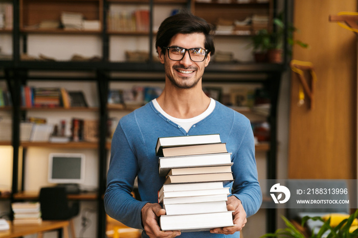 Handsome young man wearing glasses standing