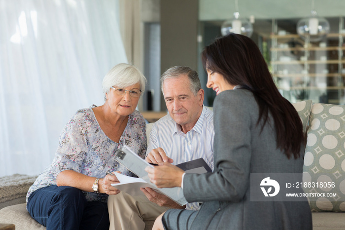 Financial advisor meeting with senior couple