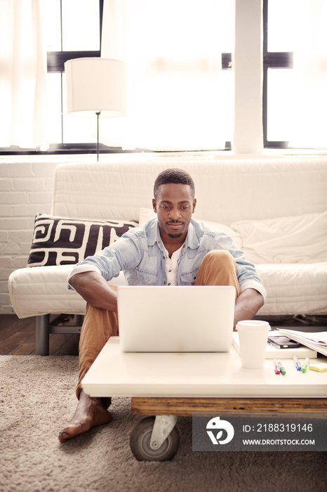 Man working on laptop at home