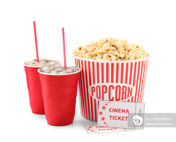 Tasty popcorn, cola and cinema tickets on white background