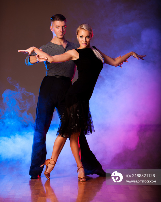 Beautiful ballroom couple preforming their pasonate exhibition d