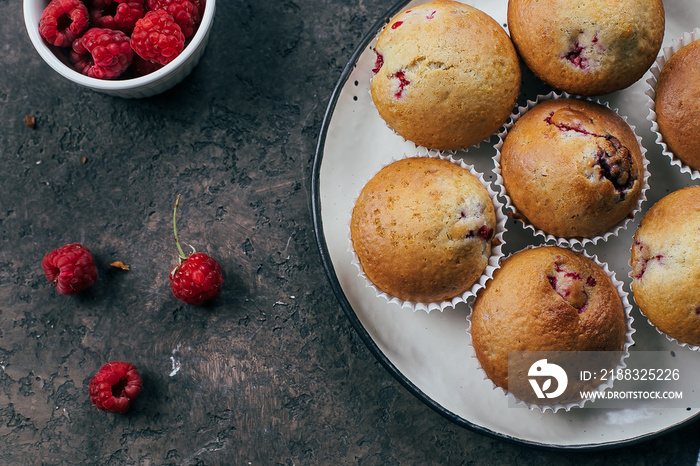 Raspberry muffins on light concrete background. Top view, flat lay