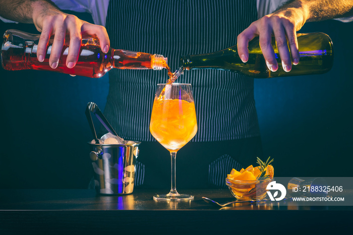 Bartender making Aperol spritz cocktail